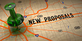New Proposals - Green Pushpin on a Map Background.