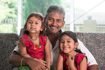 Portrait of father and daughters
