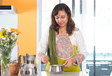 Indian housewife preparing food