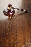 Wooden Gavel Abstract on Reflective Table