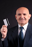 old businessman with credit card and mobile