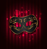 Black carnival ornate  mask on glowing background 