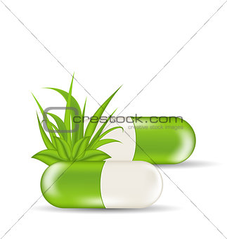 Natural medical pills with green leaves and grass, isolated on w