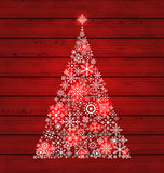Christmas fir made of snowflakes on wooden background