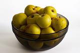 Yellow apples in glass bowl