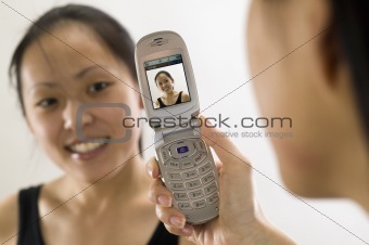 Young Asian woman with cell phone