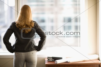 Businesswoman looking out window
