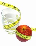Glass of Water and Red Apple with measuring tape