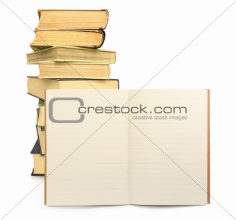 lined exercise book with books in background