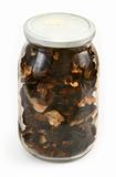 glass jar full of dried mushrooms