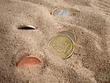 Coins In Sand