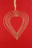 Gold heart on a red background