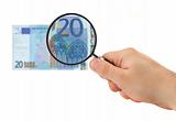 hand magnifying 20 Euro note