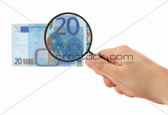 hand magnifying 20 Euro note