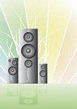 Three music speakers on a rainbow lined background