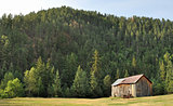 Old barn sitting on the hillside