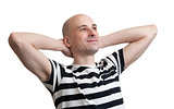 Man relaxing with hands behind his head