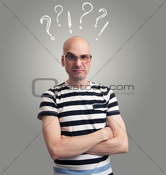 Questions. bald man with silly grimace