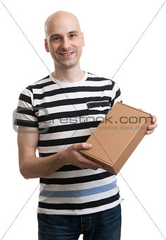 Smiling handsome male with box