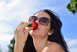 Young woman with strawberry