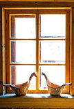 sunlit window Russian huts and carved buckets