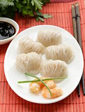 Asian steamed meat dumplings dim sum with soy sauce