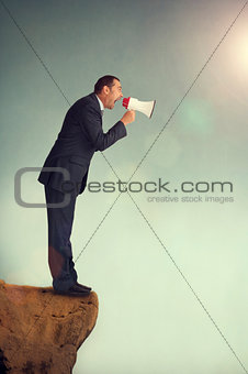 businessman shouting through a loudhailer