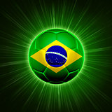 football with Brazilian flag over green rays