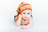 Little baby boy in a knitted hat posing