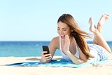 Teenager girl waving during a smart phone video call in vacations