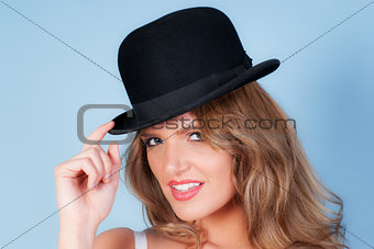 woman wearing a bowler hat