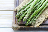fresh green organic asparagus on a wooden background