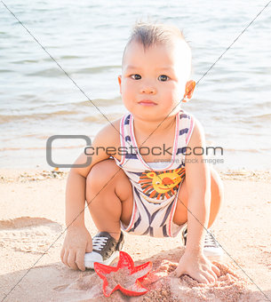 Little boy playing on the beach-WB