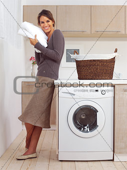 pretty smiling girl in the laundry room l