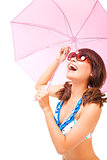 young woman holding  a umbrella to cover the sunlight
