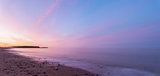 Panorama of  ocean beach at the crack of dawn