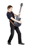 Man on a white background. Performer with an electric guitar