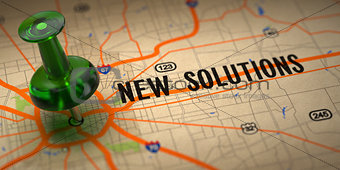New Solutions - Green Pushpin on a Map Background.
