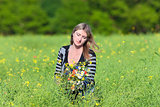 Woman Picking Wild Flowers on the Meadow 
