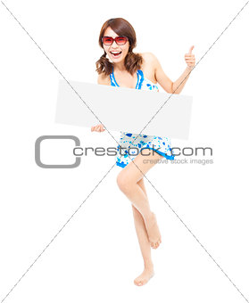 sunshine woman holding a board and thumb up gesture