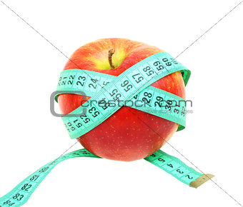Measure tape on red apple