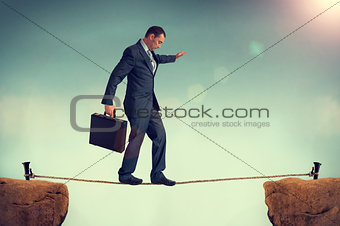 businessman balancing on a tightrope