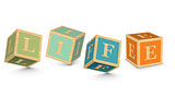 Word LIFE written with alphabet blocks