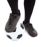 Soccer player's feet and football. isolated on a white