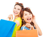 happy young women with shopping bags