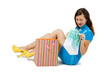 woman with packages sitting on the floor