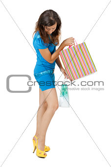 Young woman in a bright clothes shopping