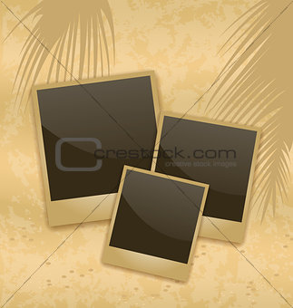 Old style empty photo cards lying on a sea sand