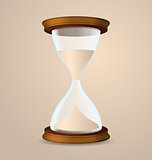Vintage hourglass isolated on beige background