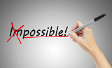 hand drawing and  changing the word impossible to possible, busi